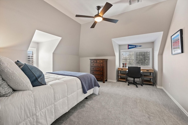 bedroom with baseboards, visible vents, lofted ceiling, and carpet