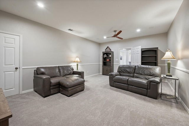 carpeted living room featuring a ceiling fan, visible vents, baseboards, and recessed lighting