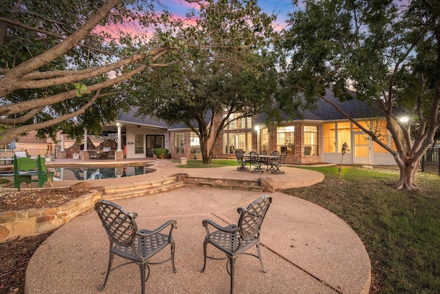 exterior space featuring an outdoor pool and fence