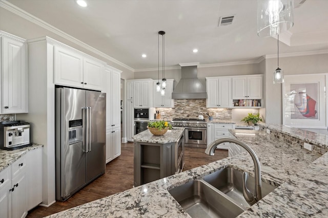 kitchen with high quality appliances, a sink, open shelves, visible vents, and custom range hood