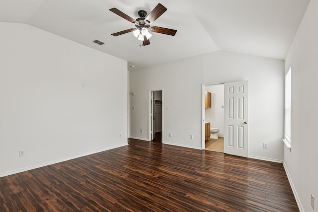 1416 Eagles Nest Trl, Krum, TX 76249 - unfurnished bedroom featuring vaulted ceiling, wood finished floors, ensuite bathroom, a walk in closet, and multiple windows