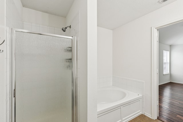 1416 Eagles Nest Trl, Krum, TX 76249 - bathroom with a shower stall, a bath, and baseboards