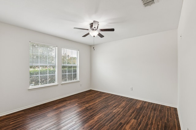 1416 Eagles Nest Trl, Krum, TX 76249 - spare room featuring dark wood-style flooring, ceiling fan, and baseboards