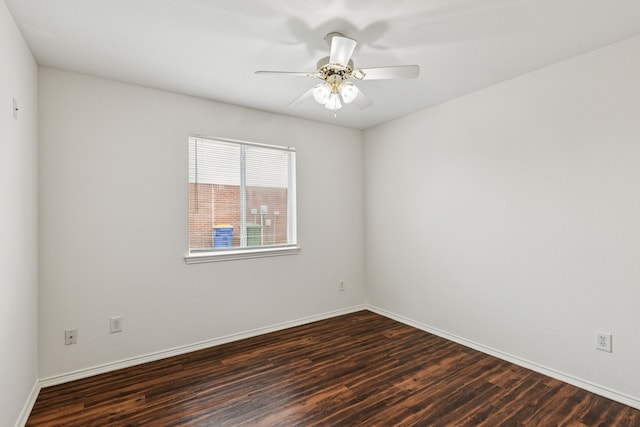 1416 Eagles Nest Trl, Krum, TX 76249 - spare room featuring dark wood finished floors, ceiling fan, and baseboards