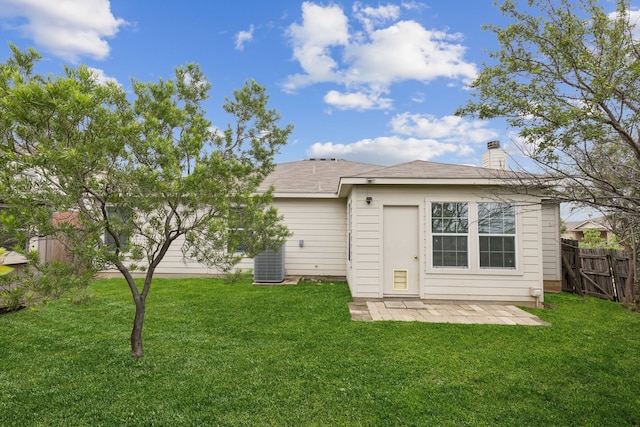1416 Eagles Nest Trl, Krum, TX 76249 - rear view of house featuring a chimney and central AC