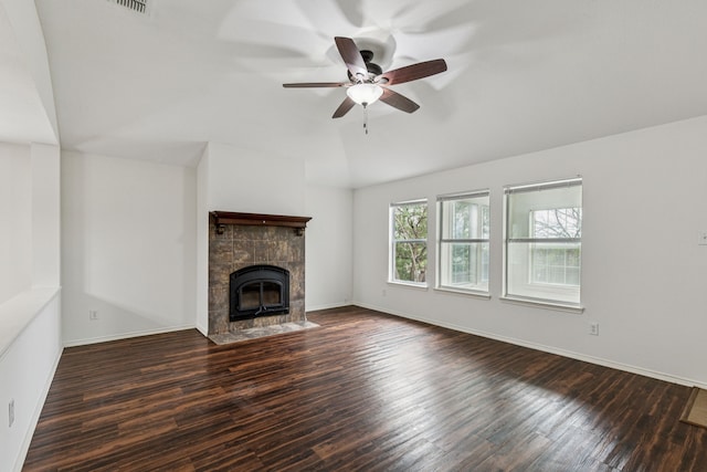 1416 Eagles Nest Trl, Krum, TX 76249 - unfurnished living room with lofted ceiling, ceiling fan, a tiled fireplace, wood finished floors, and baseboards