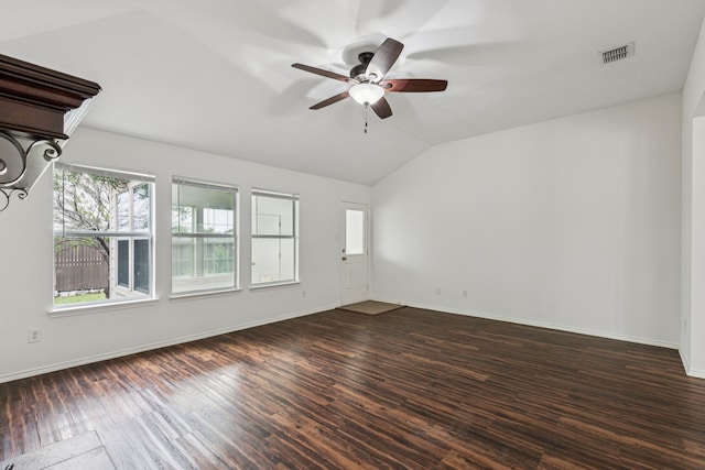 1416 Eagles Nest Trl, Krum, TX 76249 - spare room featuring lofted ceiling, dark wood-style floors, a ceiling fan, and baseboards