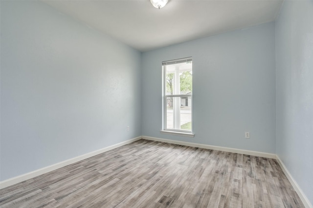 2828 Elk Grove Rd, Carrollton, TX 75007 - empty room featuring light wood-type flooring and baseboards