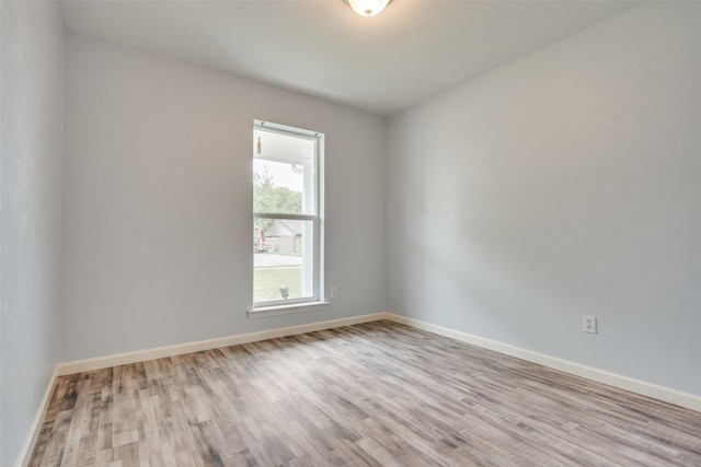 2828 Elk Grove Rd, Carrollton, TX 75007 - spare room with wood finished floors and baseboards