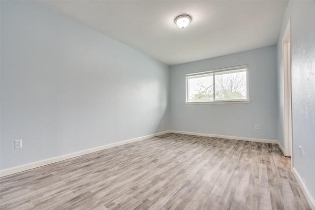 2828 Elk Grove Rd, Carrollton, TX 75007 - unfurnished room featuring light wood-style flooring and baseboards