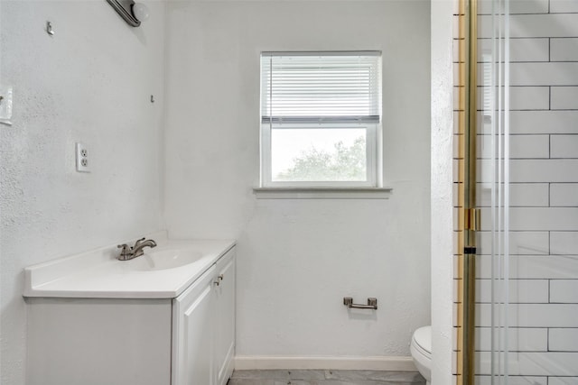 2828 Elk Grove Rd, Carrollton, TX 75007 - bathroom with vanity, toilet, baseboards, and a shower