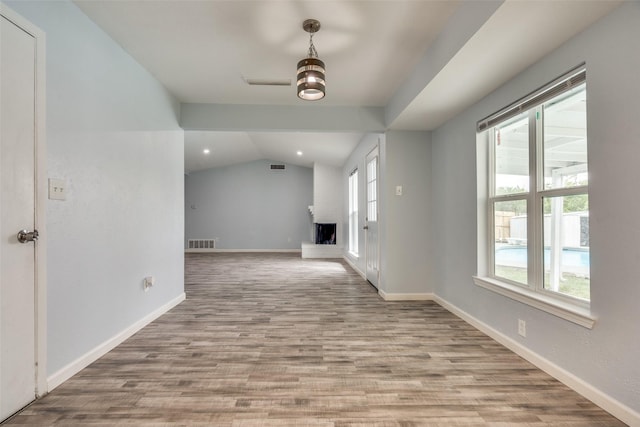 2828 Elk Grove Rd, Carrollton, TX 75007 - unfurnished living room with wood finished floors, vaulted ceiling, baseboards, and recessed lighting
