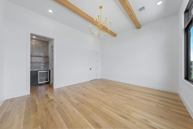 12479 Palmer Dr, Fort Worth, TX 76179 - unfurnished room with a chandelier, beamed ceiling, light wood-style flooring, healthy amount of natural light, and a dry bar