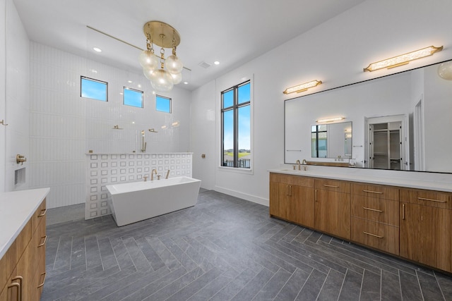 12479 Palmer Dr, Fort Worth, TX 76179 - bathroom featuring vanity, a freestanding bath, a chandelier, and recessed lighting