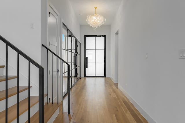 12479 Palmer Dr, Fort Worth, TX 76179 - entrance foyer featuring a chandelier, light wood-style flooring, stairway, and baseboards