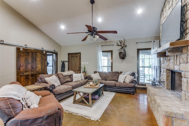 living room with a ceiling fan, recessed lighting, a stone fireplace, and lofted ceiling