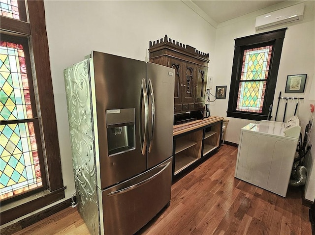 1100 Tyler St, Thornton, TX 76687 - kitchen with stainless steel fridge, a wall mounted AC, dark wood finished floors, ornamental molding, and open shelves