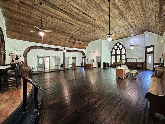 1100 Tyler St, Thornton, TX 76687 - living room featuring ceiling fan, high vaulted ceiling, wooden ceiling, hardwood / wood-style flooring, and arched walkways