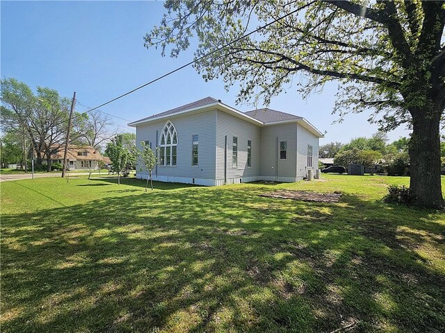 1100 Tyler St, Thornton, TX 76687 - view of property exterior featuring a lawn