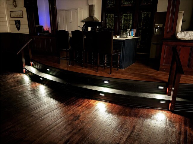 1100 Tyler St, Thornton, TX 76687 - indoor bar with wall chimney exhaust hood and wood finished floors