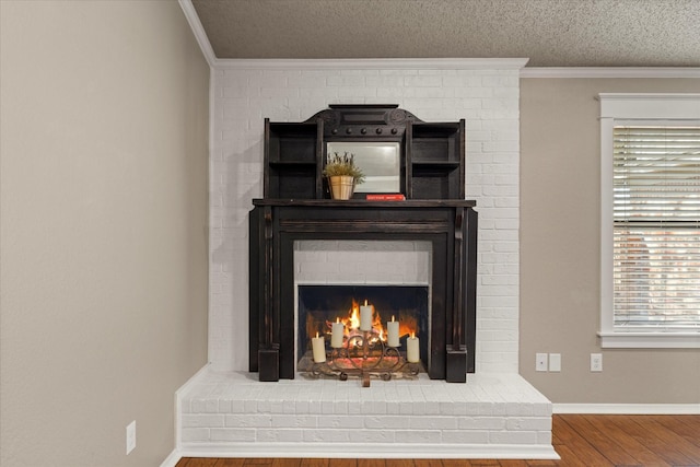 room details featuring a fireplace, wood finished floors, ornamental molding, and a textured ceiling