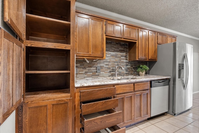 kitchen featuring a sink, brown cabinetry, dishwasher, and open shelves