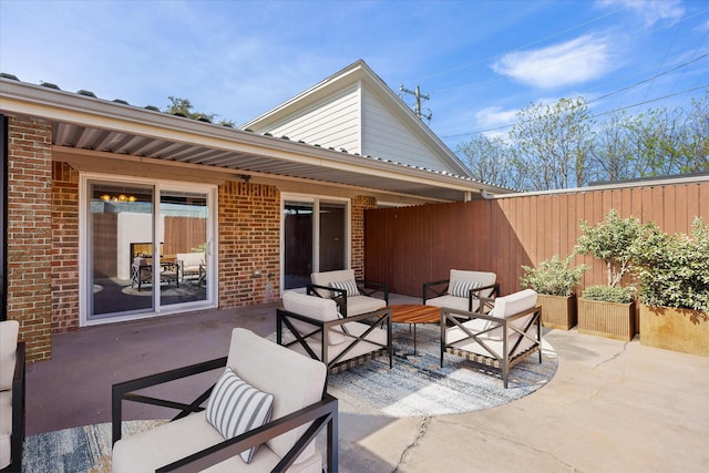 view of patio / terrace featuring an outdoor living space and fence