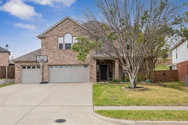8312 Rancho De La Osa Trl, Mckinney, TX 75070 - traditional home with brick siding, driveway, a garage, and central air condition unit