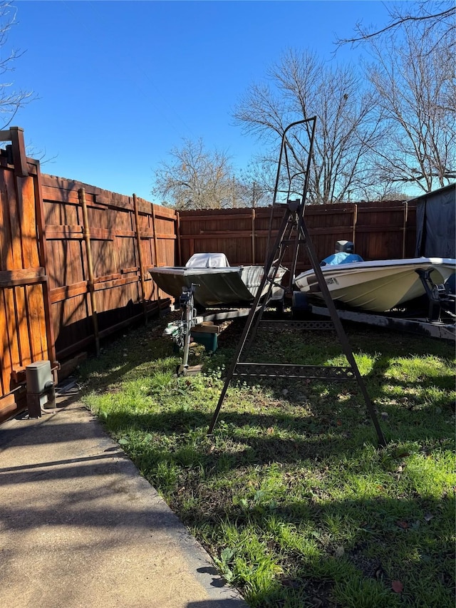 view of yard with a fenced backyard