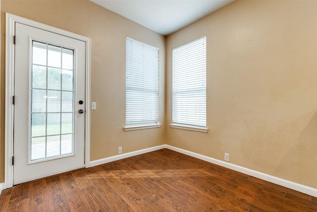 2104 Aberdeen Ave, Mckinney, TX 75072 - doorway to outside featuring dark wood-style floors and baseboards