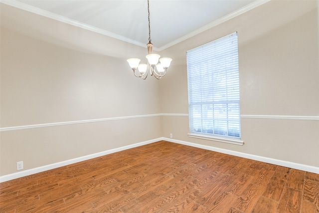 2104 Aberdeen Ave, Mckinney, TX 75072 - unfurnished room with ornamental molding, a chandelier, and wood finished floors