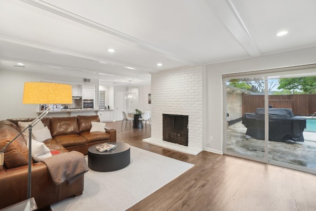 3139 Citation Dr, Dallas, TX 75229 - living room featuring beamed ceiling, wood finished floors, recessed lighting, and a fireplace