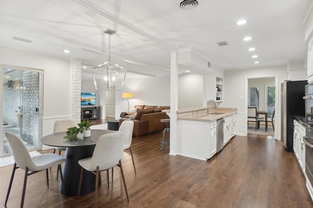 3139 Citation Dr, Dallas, TX 75229 - dining space with recessed lighting, dark wood-style floors, and a chandelier