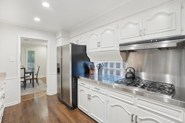 3139 Citation Dr, Dallas, TX 75229 - kitchen with stainless steel countertops, under cabinet range hood, stainless steel appliances, white cabinets, and recessed lighting