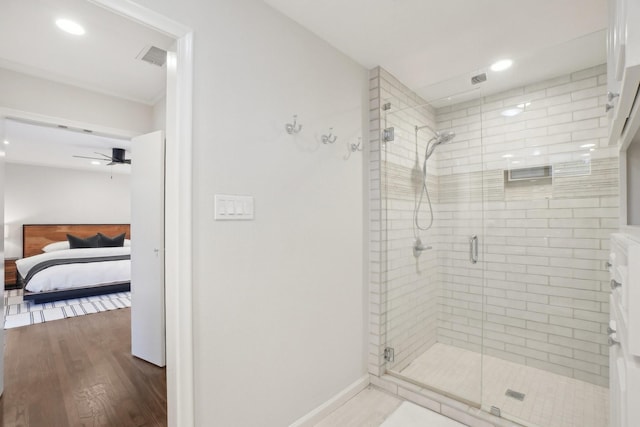 3139 Citation Dr, Dallas, TX 75229 - full bath with connected bathroom, a stall shower, wood finished floors, recessed lighting, and ceiling fan