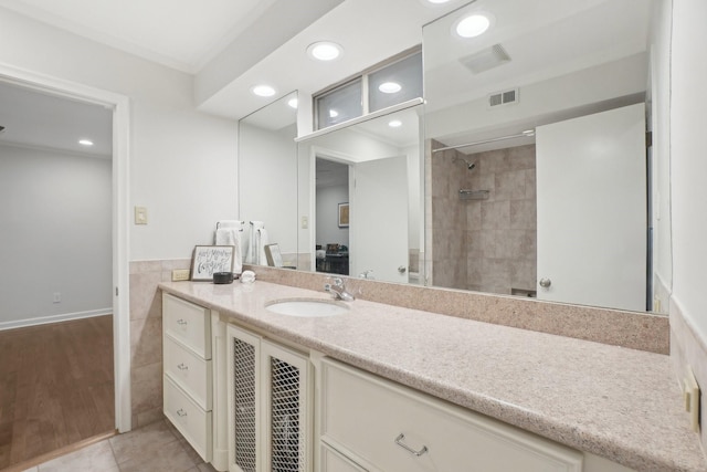 3139 Citation Dr, Dallas, TX 75229 - full bath featuring vanity, recessed lighting, tiled shower, tile patterned floors, and ensuite bathroom