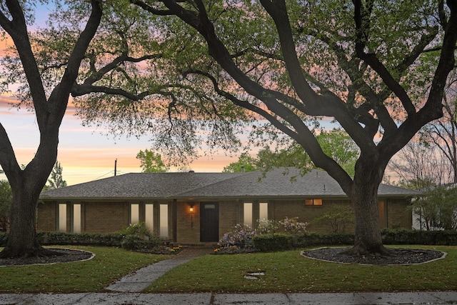 3139 Citation Dr, Dallas, TX 75229 - ranch-style house featuring brick siding and a front lawn