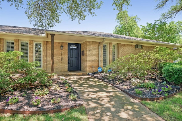 3139 Citation Dr, Dallas, TX 75229 - property entrance featuring brick siding and roof with shingles