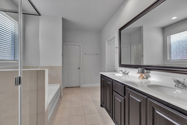 5420 Otter Trl, Fort Worth, TX 76179 - bathroom with tile patterned flooring, a bath, double vanity, and baseboards