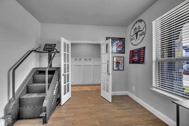 5420 Otter Trl, Fort Worth, TX 76179 - interior space with french doors, wood finished floors, healthy amount of natural light, and baseboards