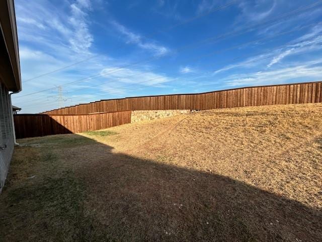 view of yard with a fenced backyard
