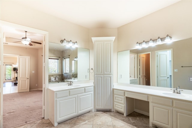 full bathroom featuring tile patterned floors, a ceiling fan, a sink, and two vanities