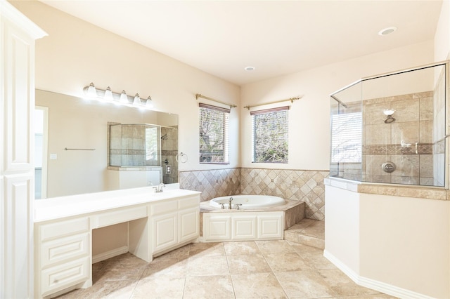 full bath featuring a tile shower, a garden tub, tile patterned floors, and vanity