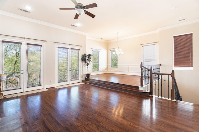 unfurnished room featuring visible vents, wood finished floors, and plenty of natural light