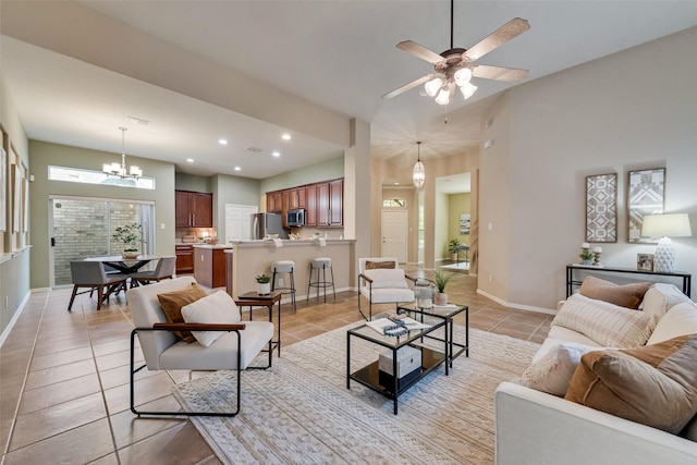 5685 Country View Ln, Frisco, TX 75036 - living area featuring light tile patterned floors, ceiling fan, baseboards, a chandelier, and recessed lighting