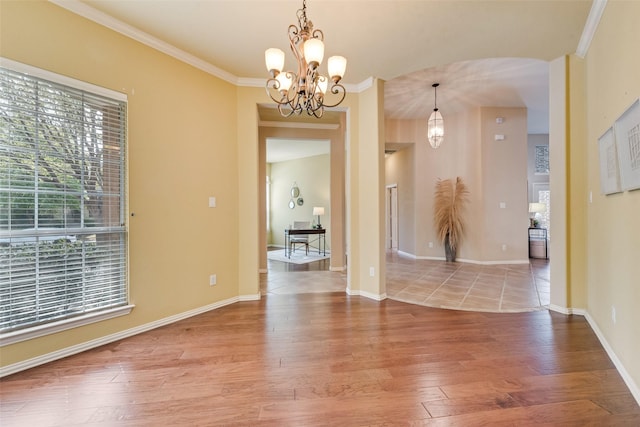 5685 Country View Ln, Frisco, TX 75036 - empty room featuring hardwood / wood-style floors, a chandelier, crown molding, and baseboards