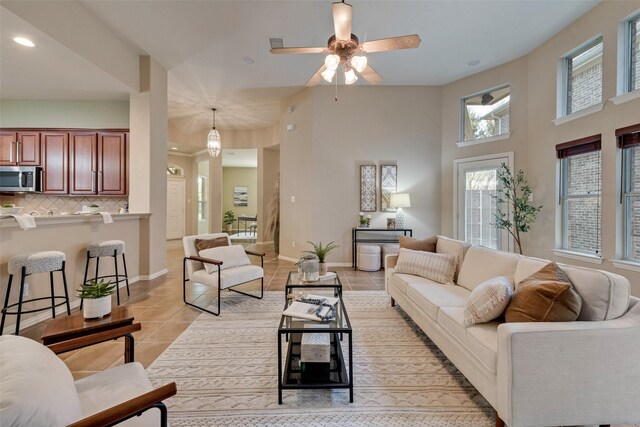 5685 Country View Ln, Frisco, TX 75036 - living area featuring light tile patterned floors, recessed lighting, ceiling fan, and baseboards