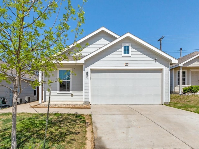 ranch-style house featuring concrete driveway and a garage