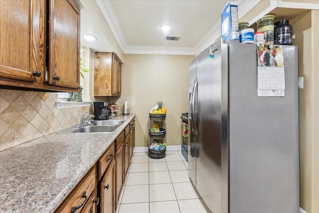 405 Rosewood Hills Dr, Garland, TX 75040 - kitchen with ornamental molding, stainless steel fridge with ice dispenser, a sink, light tile patterned flooring, and visible vents