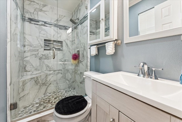 405 Rosewood Hills Dr, Garland, TX 75040 - bathroom with toilet, vanity, a textured wall, and a marble finish shower